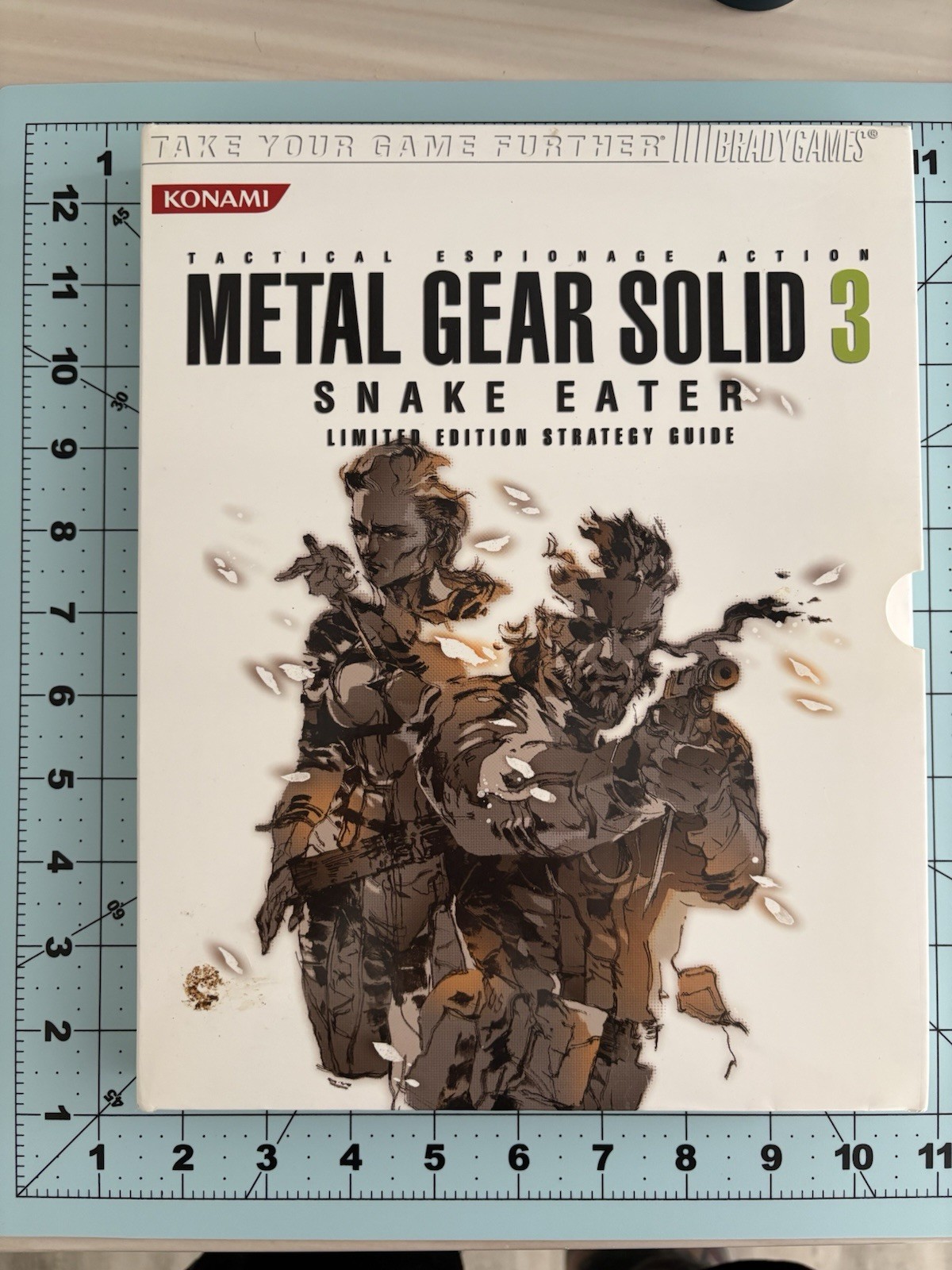 Metal Gear Solid collector lot with Uniqlo 25th Anniversary shirt