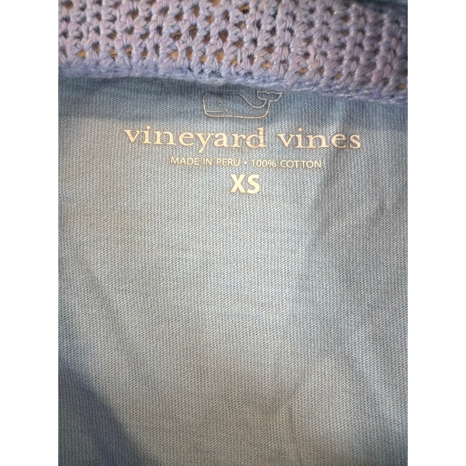 Sky blue long sleeve tee with logo on pocket and sleeve.