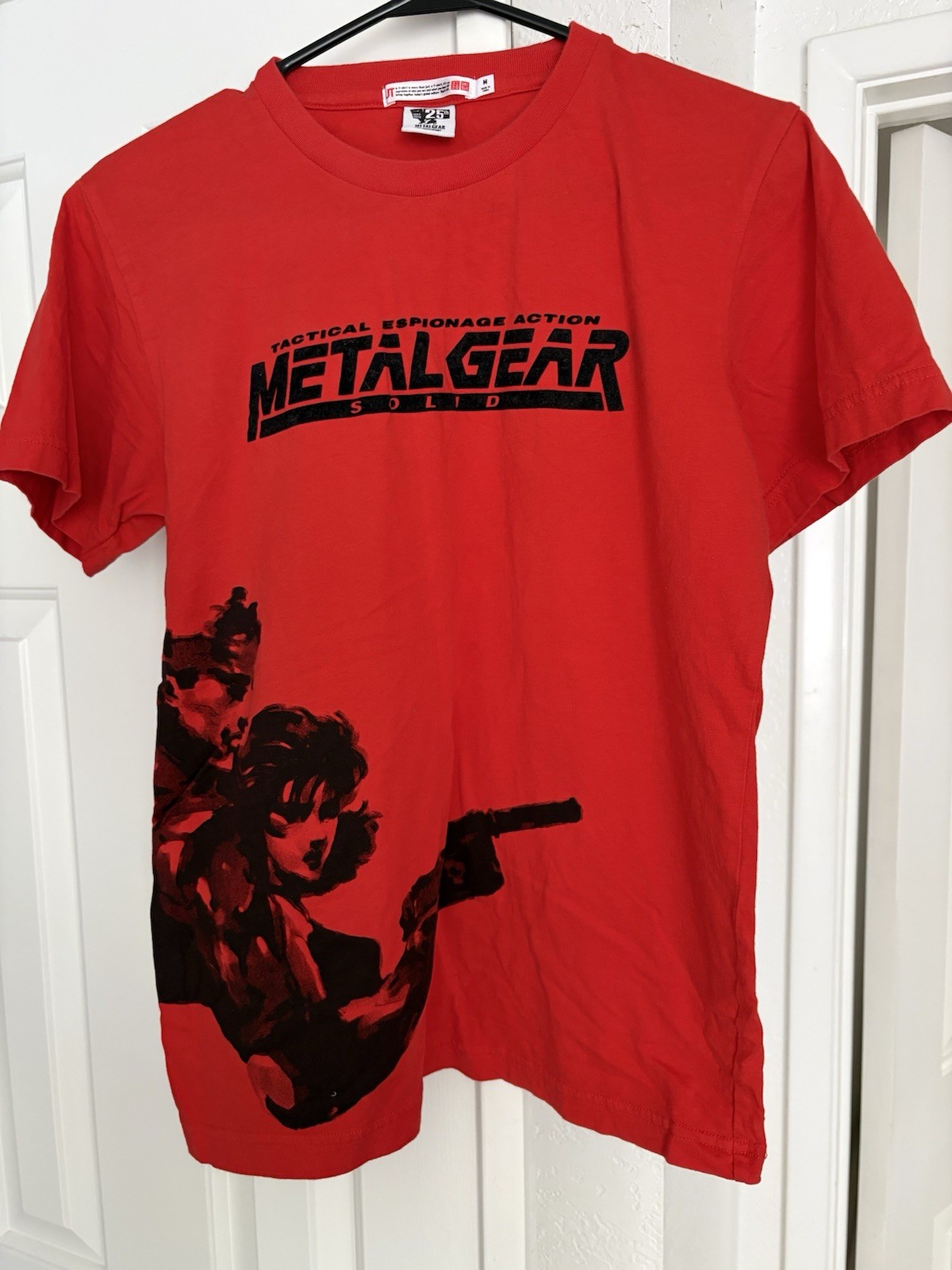 Metal Gear Solid collector lot with Uniqlo 25th Anniversary shirt