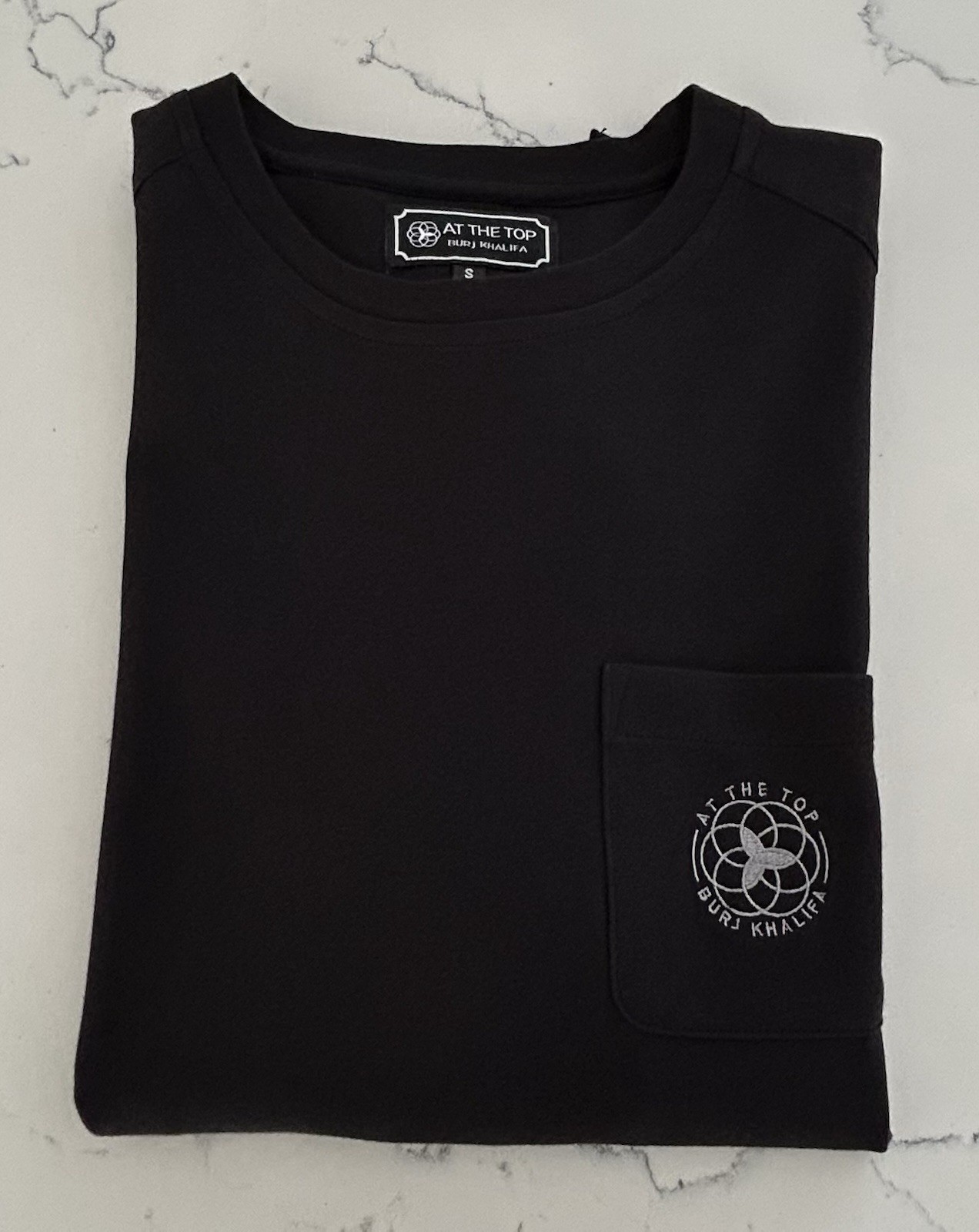 At The Top Of Burj Khalifa skyscraper, Dubai, UAE – Black Pocket Logo T-Shirt, S
