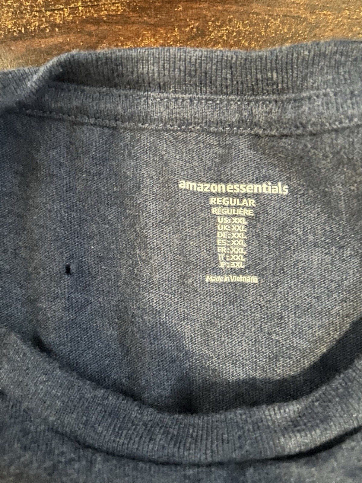 blue amazon essentials longsleeve size 2xl small hole on back and sleeve