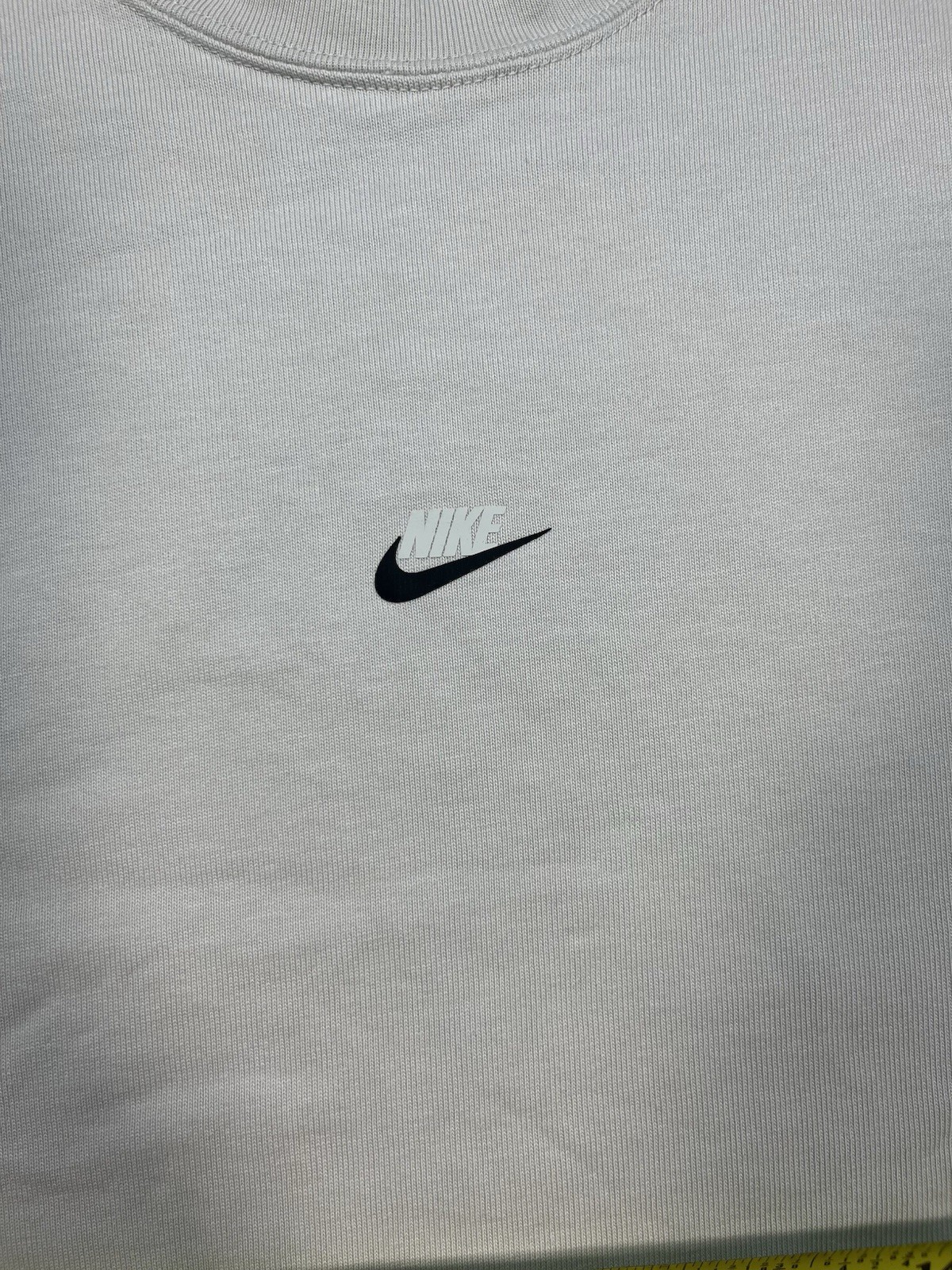 Nike long sleeve mock neck top in Light Bone featuring a small swoosh logo