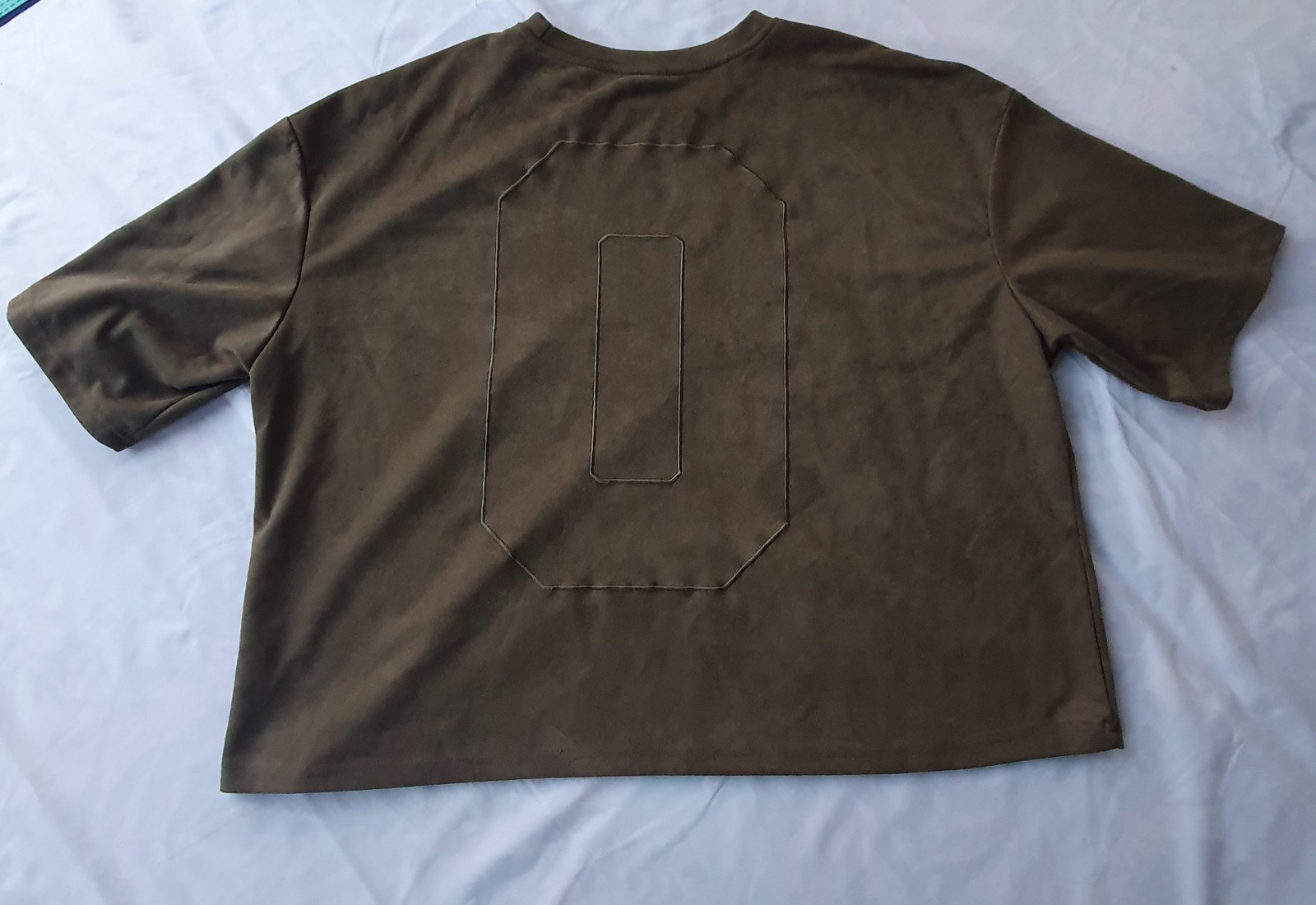 MANFINITY t-shirt with a simulated 0 graphic on the back and a distinctive soft