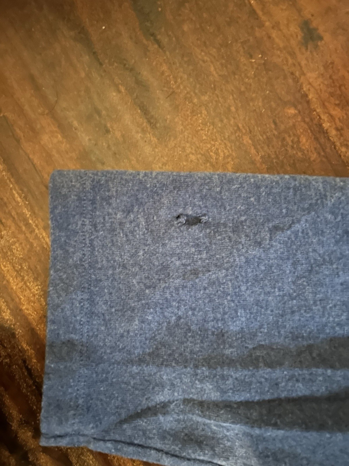 blue amazon essentials longsleeve size 2xl small hole on back and sleeve