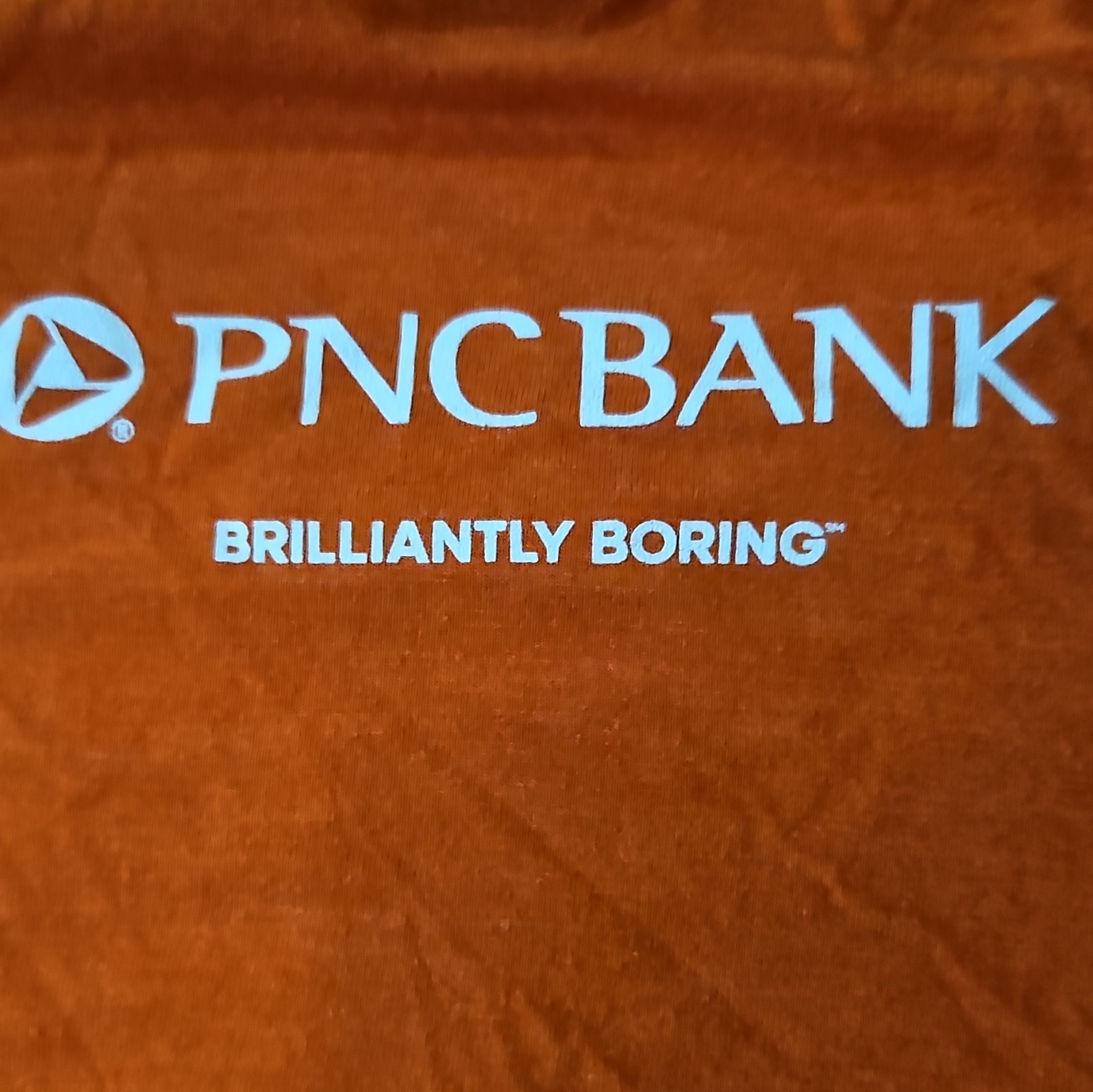 District Men’s L Orange PNC Bank « Brilliantly Boring » Logo Graphic T-Shirt
