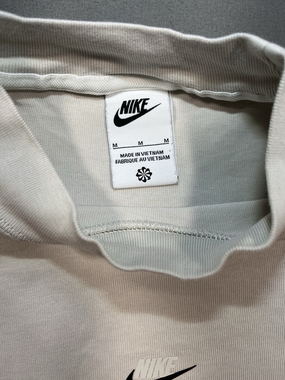 Nike long sleeve mock neck top in Light Bone featuring a small swoosh logo