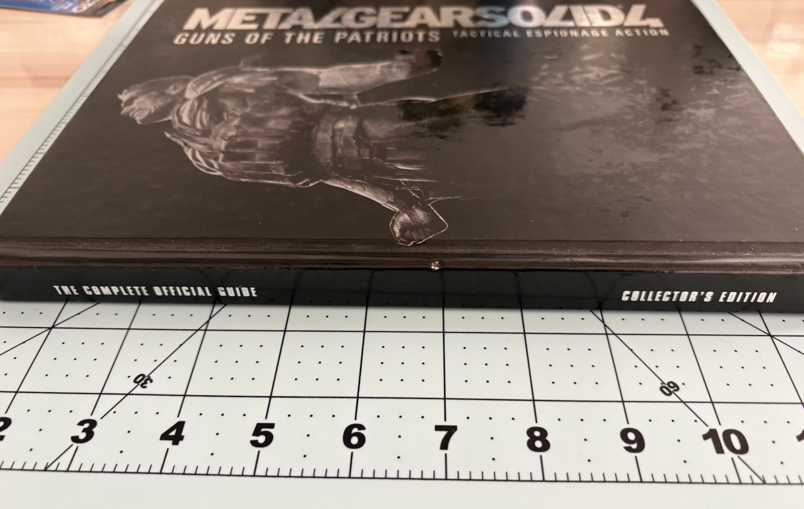 Metal Gear Solid collector lot with Uniqlo 25th Anniversary shirt
