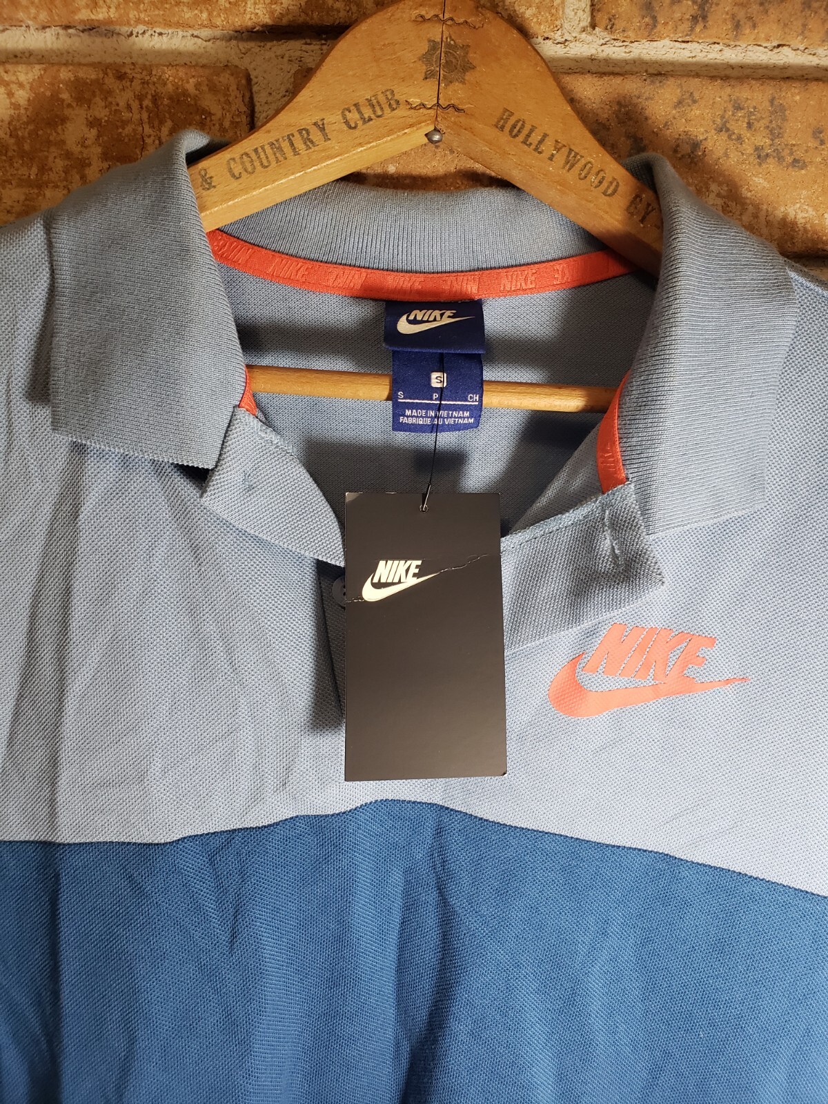 New with tag! Tri tone color Small Nike Polo shirt Blues And Red.