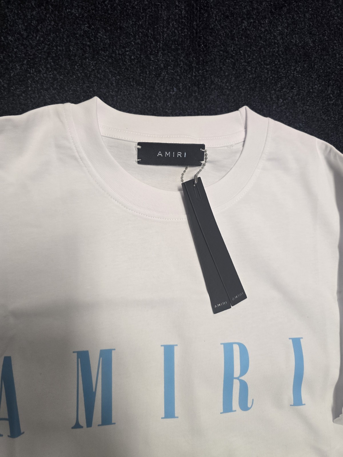 AMIRI Men’s White/Blue Logo Graphic Print Crew Neck Short Sleeve T-Shirt Regular