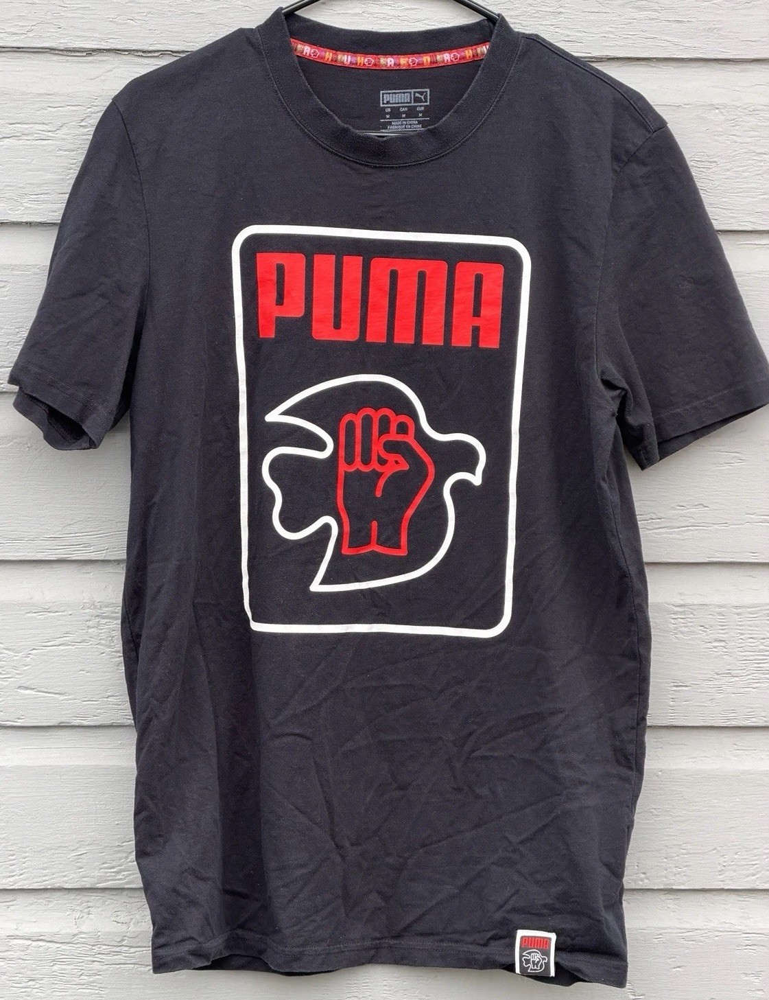 Puma x Lance Wyman Men’s Tee Shirt MEDIUM Power Through Peace Defenition Graphic
