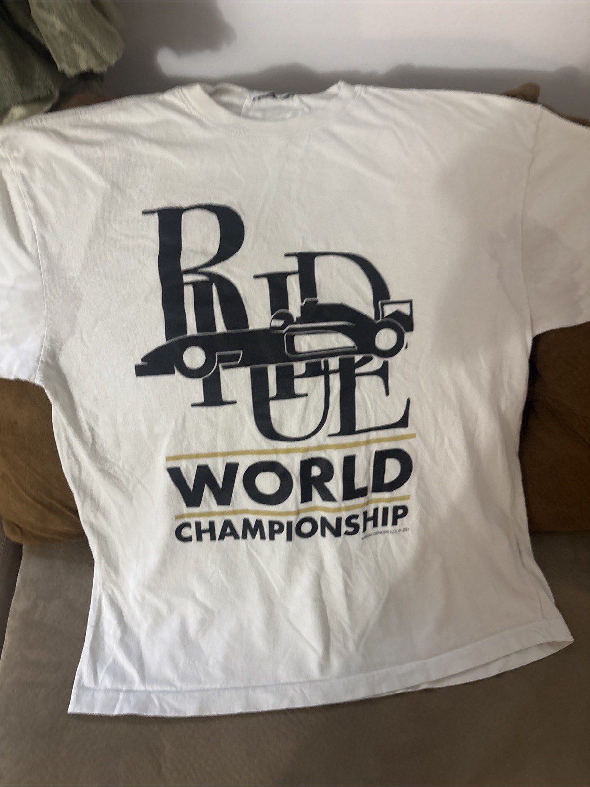 RHUDE World Championship Ivory Cotton Graphic Short Sleeve. Marks Under Arms